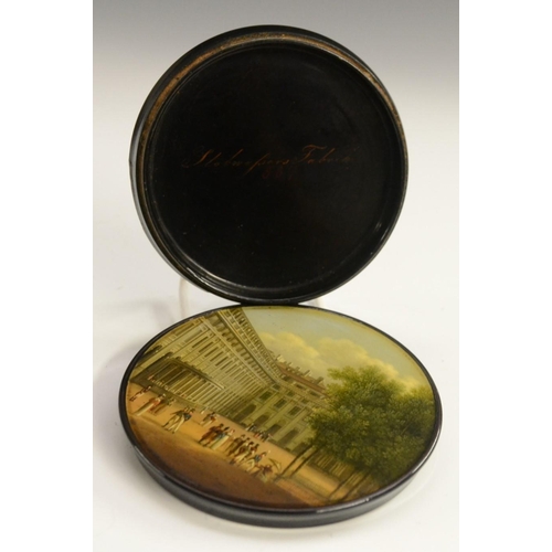 1153 - An early 19th century German Named-View papier-mâché circular table-top snuff box, by Stobwasser of ... 