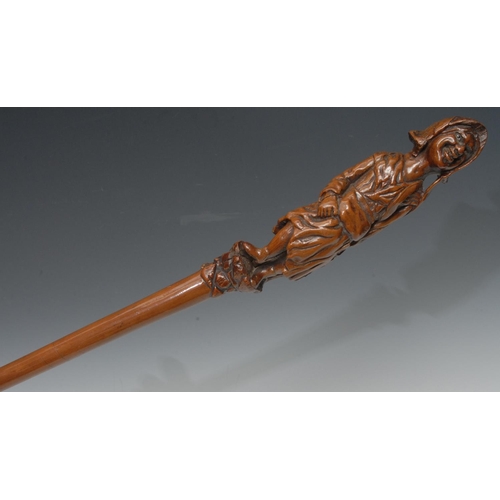 1178 - A 19th century Folk Art walking cane, carved with a grape picker, 95cm long