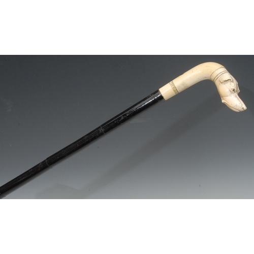 1192 - A 19th century walking stick, the ivory handle carved with a greyhound, inscribed From G.G.P., segme... 