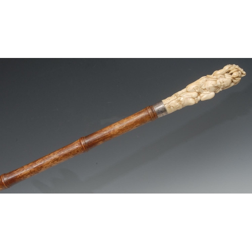 1193 - A 20th century Japanese walking stick, the ivory pommel carved with fisherman holding a hermit crab ... 