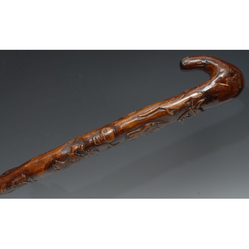 1199 - A 19th century Folk Art stick, carved with Vikings and Christian symbols, 95cm long