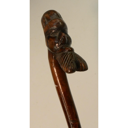 1207 - Folk Art - a 19th century novelty hedgerow walking stick, boldly carved with the head of a stylized ... 