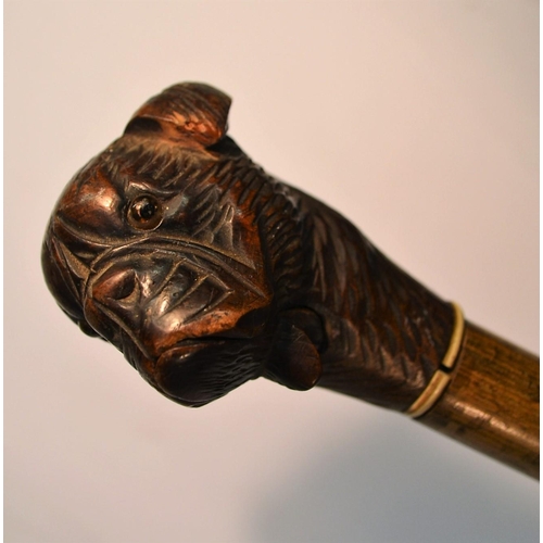 1227 - A Black Forest novelty automaton walking cane, the pommel carved as the head of a dog, articulated m... 