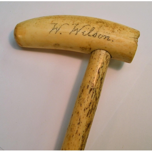 1228 - An early 19th century sailor's folk art whale bone walking stick, the scrimshaw tooth handle inscrib... 