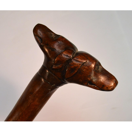 1232 - A 19th century fruitwood gentleman's novelty walking stick, the 'janus' pommel carved with two dogs'... 