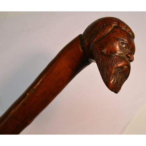 1233 - A 19th century gentleman's novelty walking stick, the pommel carved with the head of a bearded man, ... 