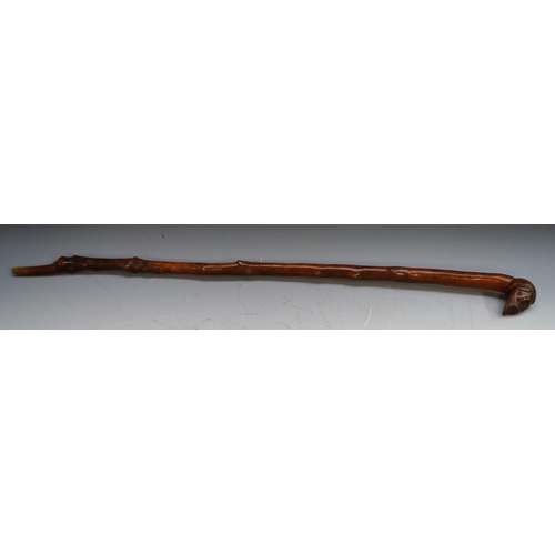 1233 - A 19th century gentleman's novelty walking stick, the pommel carved with the head of a bearded man, ... 