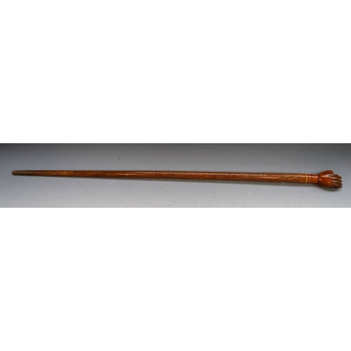 1236 - A South Seas novelty walking stick, the hardwood pommel carved as a fist and stamped Pitcairn Island... 