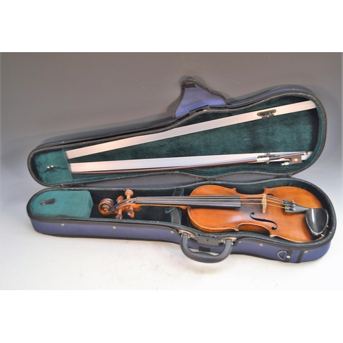 1250 - A 19th century German violin, Guarnerious copy, the two-piece back 35cm long excluding button,  outl... 