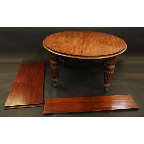 1285 - A Victorian mahogany wind out dining table, moulded top above a deep frieze, substantial turned and ... 