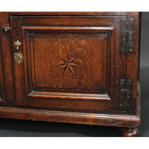 1291 - A '17th century' oak block front low dresser, three-plank top with applied moulded edge, above three... 