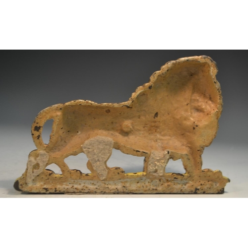 1318 - A 19th century cast iron novelty door stop, as a lion, painted in polychrome, 22.5cm wide, c.1850