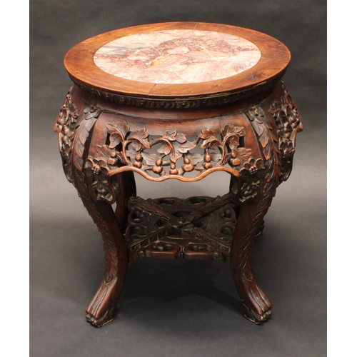 1322 - A 19th century Chinese hardwood jardiniere stand, circular top with inset soapstone panel above a sh... 