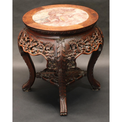 1322 - A 19th century Chinese hardwood jardiniere stand, circular top with inset soapstone panel above a sh... 