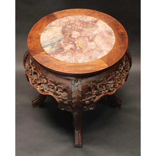 1322 - A 19th century Chinese hardwood jardiniere stand, circular top with inset soapstone panel above a sh... 