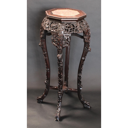 1323 - A 19th century Chinese hardwood jardiniere stand, octagonal top with inset soapstone panel, beaded b... 