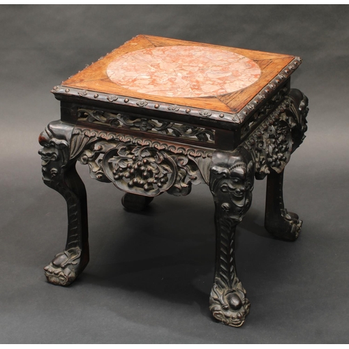 1324 - A 19th century Chinese hardwood jardiniere stand, square top with inset soapstone panel, above a dee... 