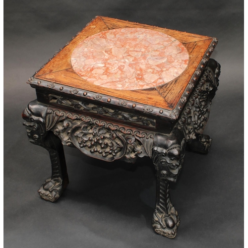 1324 - A 19th century Chinese hardwood jardiniere stand, square top with inset soapstone panel, above a dee... 