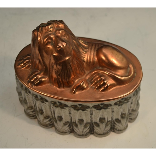 1328 - A 19th century copper and tin novelty jelly mould, as a recumbent lion, 16cm long