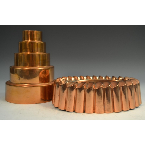 1330 - A 19th century copper fluted oval 'ring' jelly mould, 21cm wide; a 19th century circular graduated '... 