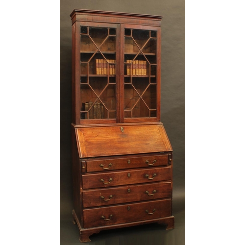 1331 - A George II/early George II mahogany bureau bookcase, moulded cornice above a pair of astragal glaze... 