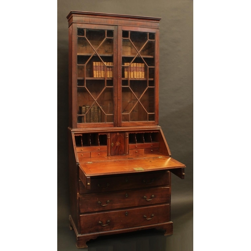 1331 - A George II/early George II mahogany bureau bookcase, moulded cornice above a pair of astragal glaze... 