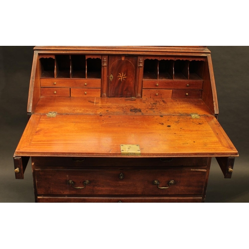 1331 - A George II/early George II mahogany bureau bookcase, moulded cornice above a pair of astragal glaze... 