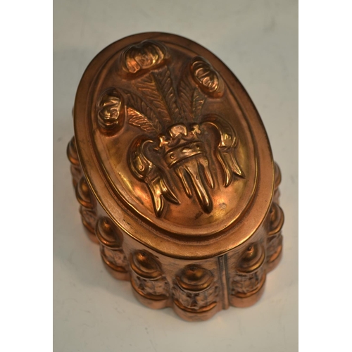 1332 - A 19th century copper novelty jelly mould, embossed with Prince of Wales feathers, the fluted side w... 