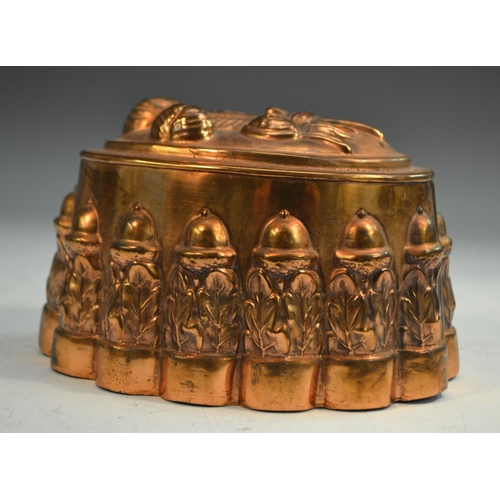 1332 - A 19th century copper novelty jelly mould, embossed with Prince of Wales feathers, the fluted side w... 