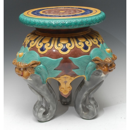 1341 - A 19th century French Chinoiserie majolica garden seat, the circular top in relief with a stylized f... 