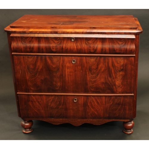 1355 - A 19th century German 'Biedermeier' flame mahogany chest, caddy top above three drawers, turned fore... 