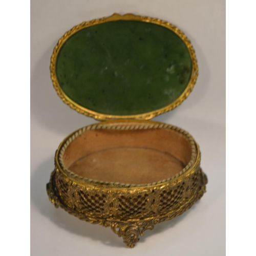 1356 - A 19th century gilt metal and spinach jade oval casket, hinged cover, the side pierced and chased wi... 