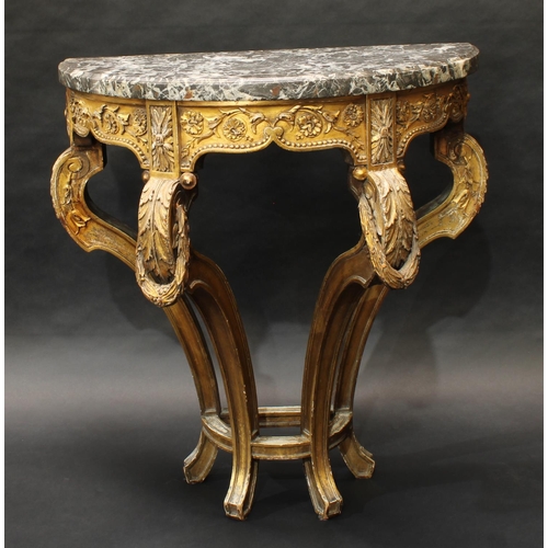 1360 - A 19th century giltwood demilune console table, veined marble top above a deep frieze carved with le... 