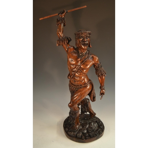 1365 - A 19th century hardwood figure, of an African warrior, standing with spear raised, 60cm high