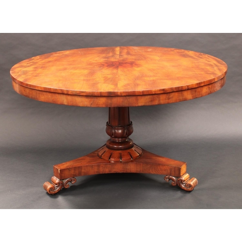 1375 - A 19th century mahogany circular centre table, slightly oversailing top above a deep frieze, turned ... 