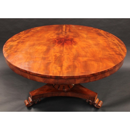 1375 - A 19th century mahogany circular centre table, slightly oversailing top above a deep frieze, turned ... 