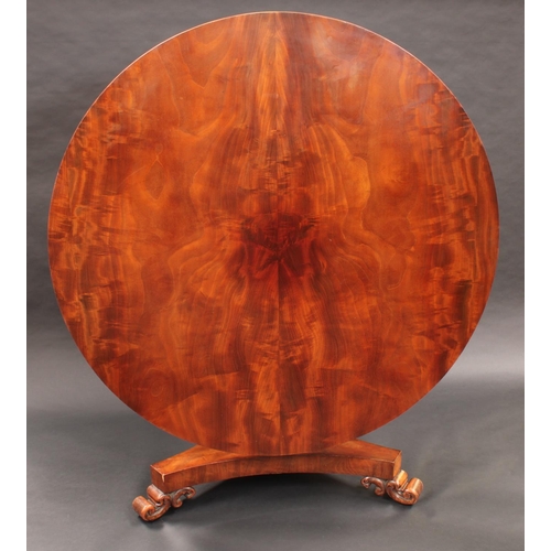 1375 - A 19th century mahogany circular centre table, slightly oversailing top above a deep frieze, turned ... 