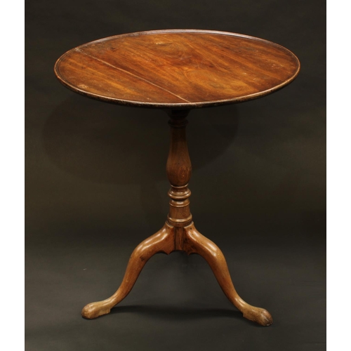 1376 - A 19th century mahogany occasional table, the dished top tilting on  bird cage, baluster column, pad... 