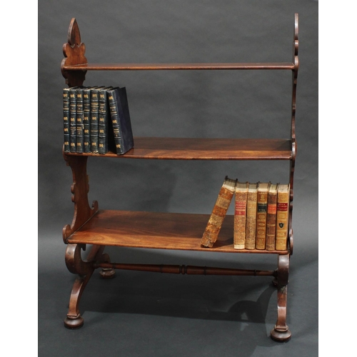 1378 - A 19th century mahogany room centre waterfall open bookcase/whatnot, shaped end supports, downswept ... 