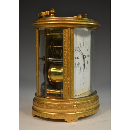 1389 - A 19th century oval repeater carriage clock, Roman numerals, subsidiary dial, engraved with foliage,... 