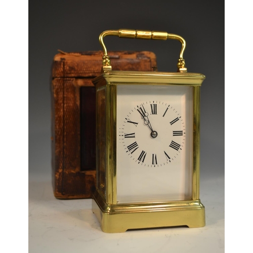 1390 - A 19th century repeater carriage clock, with Roman numerals, bevelled glass panels, swing handle, 19... 