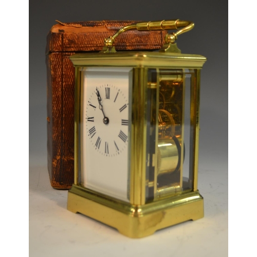 1390 - A 19th century repeater carriage clock, with Roman numerals, bevelled glass panels, swing handle, 19... 