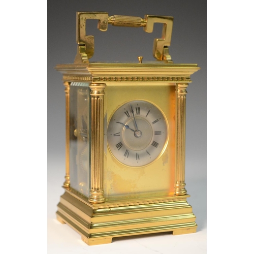 1391 - A 19th century repeater carriage clock, with Roman numerals, silvered chapter ring, fluted column to... 