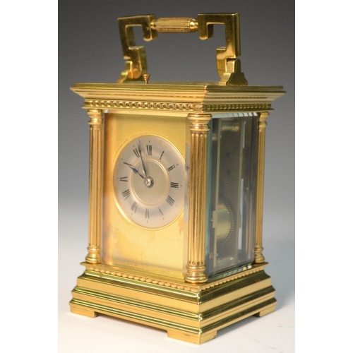 1391 - A 19th century repeater carriage clock, with Roman numerals, silvered chapter ring, fluted column to... 