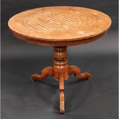 1392 - An Italian walnut and parquetry circular centre table, inlaid with a field of tumbling blocks, turne... 