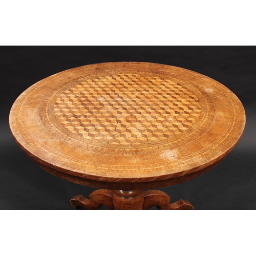 1392 - An Italian walnut and parquetry circular centre table, inlaid with a field of tumbling blocks, turne... 