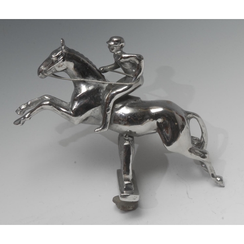 1408 - A 20th century chrome plated car mascot, of a jockey taking a steeple fence, 14cm high