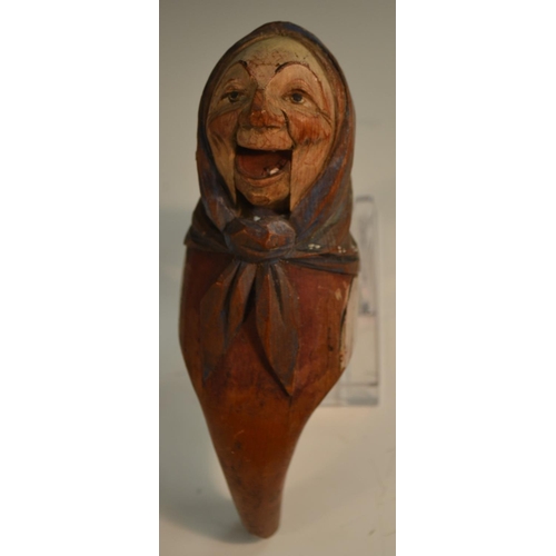 1411 - A Black Forest lever action novelty nut cracker, carved and polychrome painted as a Tyrolean peasant... 