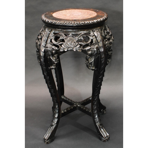 1426 - A Chinese hardwood jardiniere stand, circular top with ovolo border and inset soapstone panel, above... 