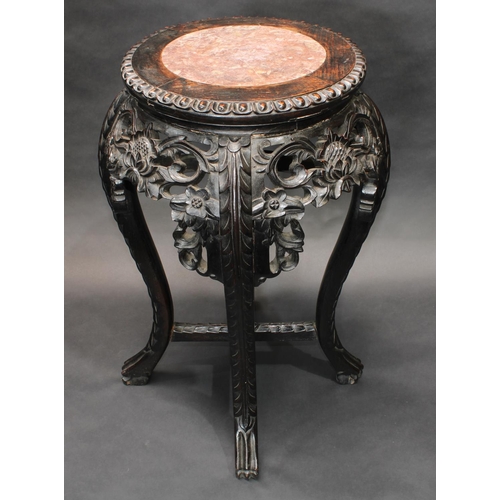 1426 - A Chinese hardwood jardiniere stand, circular top with ovolo border and inset soapstone panel, above... 